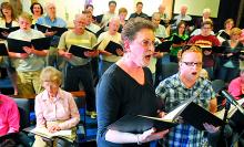 Nancy Karchner, left, and Merry Acor sing with the Danville Community Singers during rehearsal for the ensemble's upcoming spring concert, scheduled for May 13 at 7 p.m. at St. Peter's United Methodist Church in Riverside. 