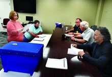 Conducting the Montour County certification of the primary election, in the Montour Administration Building on Friday morning, are, from left, Holly Brandon, chief clerk and director of elections; Ryan Craig, assistant director of elections; r Ken Holdren, retiring county commissioner; Tom Benfer, standing in for commissioner Trevor Finn; and Dan Hartman, retiring county commissioner. Commissioners running in the election cannot participate in the certification. Holdren and Hartman are not running for re-