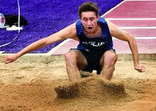 Central Columbia’s Andrew Beagle competes in the broad jump during the PHAC track and field championships at Danville on Saturday. 