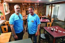 Partners Hassan Soliman, left, and Gamal Elkadousi stand in one of the dining areas of their new Star Family Restaurant along Route 11 in South Centre Township Friday.