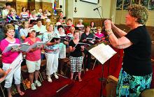 Director Pat Gensemer, right, conducts the Bicentennial Choir during rehearsal Sunday afternoon for the group's upcoming spring concert, "God Gave Us Music," at Wesley United Methodist Church in Bloomsburg. The performances will be held at the church June 8 and 9 at 7 p.m. It is the 12th annual spring concert for the choir. Touch of Brass will also perform.