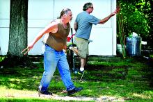 Contestants Ed Fair, left, an Ken Strausser, both of Danville, warm up before the start of the Continental Fire Company’s Horseshoe Tournament at the Southside Fire Company grounds in Riverside on Saturday. About 30 players participated in the tournament that was part of Continental’s 150th anniversary celebration.