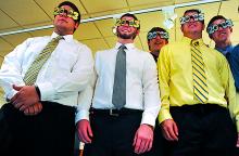 Southern Columbia graduates, from left, Ryan Cherwinski, Jeff Rooney, Taylor Young, Jake Becker and Matt Klock pose for pictures wearing 2013 glasses before their commencement ceremony Sunday at Mitrani Hall at Bloomsburg University.