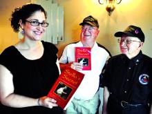 Schuylar Rosenberg, Berwick, stands with Columbia County veterans Dick Donald, center, and Roy Kilpatrick after to speaking during the veterans’ breakfast meeting at the Morris Family Restaurant on Thursday.