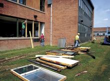 Zartman Construction workers replace windows on Bloomsburg High School on Monday. The $731,000 project to replace all the windows in the high school is expected to be completed by Aug. 15.
