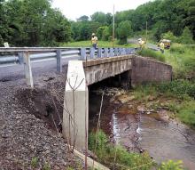 A PennDOT survey crew makes final preparations, on Monday, before a bridge replacement project gets underway on this Little Roaring Creek Road bridge over Little Roaring Creek. The creek is the border between Mayberry Township, on the left, and Rush Township. A detour onto Sharp Ridge Road and Susquehanna Road will be in effect until the project is completed in late July.