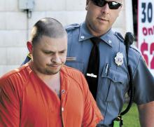 Alleged meth maker Paul Wayne Cummings, 33, of Numidia, is escorted by Locust Township Police Officer Chris Snyder into District Judge Craig Long’s court in Catawissa on Tuesday morning.
