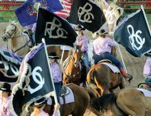 The Benton Rodeo Chicks perform in the Benton Rodeo arena Tuesday evening.