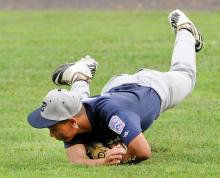 Berwick's Jy James is able to hold on to the ball while making a diving catch in center field for the out on South Columbia's Jake Snyder in the fourth inning. 