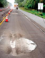 In preparation for a microsurfacing project on a section of Route 11 between Scott Township and Berwick, a PennDOT crew grinds off the anti-tailgating dots on Route 11 in South Centre Township on Tuesday morning.