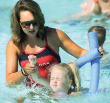 Gianna Bangs, 5, Berwick, gets a little help from swimming instructor Hope Kile during swimming lessons at Bloomsburg Town Pool Wednesday morning. This year, the lifequards are helping 53 children hone their swimming skills at the Norris E. Rock Public Swimming Pool.