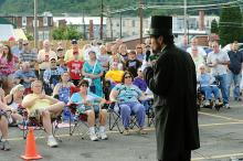 Lincoln actor and historian James Getty recites the Gettysburg Address at the stage at Cole’s Hardware in Danville Friday evening as part of the Iron Heritage Festival activities.