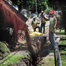 Workers with Kriger Construction of Dickson City install a new high-density plastic gas main along Old Berwick Road in Espy for UGI Penn Natural Gas on Wednesday. The project will extend from the 1000 block of Old Berwick Road to Central Columbia High School and is expected to take four to five months to complete.