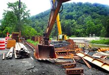 A crew with HRI, Inc. of State College continues construction of the Dump Hill Road replacement bridge over Nescopeck Creek in Nescopeck Township on Tuesday. Construction of the three-span spread box beam bridge is expected to be completed in October. The old open grate steel truss bridge was built in 1905. It was closed to traffic in 2016 and demolished last year.