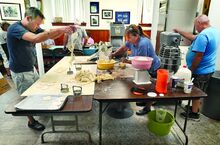  St. Mary’s parishioners, from left, David Beach, Mary Beach and Eric Kishbaugh, along with several others, make pierogies in the church basement in Mocanaqua on Tuesday. The plan is to make 4,000 cheese pierogies and sauerkraut pierogies on Tuesday and 3,000 more today. Those will be added to the 7,000 potato pierogies already made back in June, all for the annual St. Mary’s Homecoming Picnic to be held in Sobieski Park on Saturday and Sunday of Labor Day weekend. 