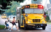 Seventh grader Emily Zimmerman and her brother Lucas Zimmerman, fifth grade, board the school bus on Old Berwick Road in Espy on Thursday morning, on their way to the first day of school for the Central Columbia school district. 