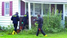 The State Police drug lab team enters a home at 9 Skyview Road in Catawissa Township to investigate a suspected meth lab Tuesday. See our story, Page 1.