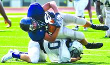 Central's Payton Aucher, top, is stopped by a G.A.R. defender Saturday morning at Bloomsburg University.