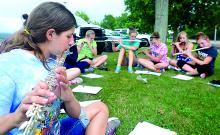 Danville freshman Genevieve Zola plays with the flute players during band camp for the Danville High School Marching Band Thursday at the high school. Band Camp continues through Wednesday and the annual preview night will be Friday, Aug. 15.