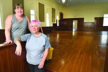 Columbia County Traveling Library director Amanda Noblit, left, and assistant director Kara Walsh standing in what will be the adult area of the new Catawissa location Monday afternoon. They will be moving into the old senior center at 319 Pine Street in the borough. 