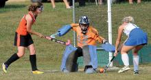 Warrior Run's Holly Jones, right, blocks a shot by Benton/Millville's Leann Siedel, left, in front of Warrior Run goalkeeper Nicole Temple during the first half of Tuesday afternoon's game at Warrior Run. 