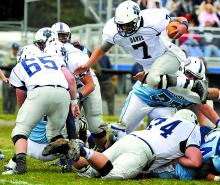 Berwick quarterback C.J. Curry jumps over the line and into the end zone for a touchdown Saturday in Dallas. Berwick won 37-7.