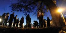 Members of the Berwick Area Community Watch group gather at the intersection of Third and Mulberry streets Wednesday evening before heading out to walk through the borough, on Mulberry, Ninth and Vine streets. (Press Enterprise/Jimmy May)