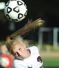 Bloomsburg's Shannon Laubach heads the ball towards the Bishop Neumann goal in the first half of their game Tuesday at Bloomsburg.