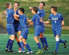 Warrior Run's Zack Miller, second from left, gets hugged by Chase Snyder, left, and Nick McCormack, Hunter Confair, James Hamm and Alex Wehr, after he scored Warrior Run's winning goal against Central Columbia Tuesday at Loyalsock.
