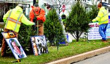 Workers put the finishing touches on Christmas Boulevard Friday