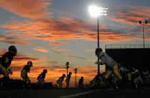 Members of the Bloomsburg University football team run through plays Wednesday evening on Danny Hale Field at Redman Stadium while preparing for Saturday's game against West Chester. 