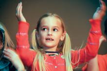 Southern Columbia second-grader Kate Moncavage sings "Kye, Kye, Kule" with her fellow classmates during a rehearsal Tuesday morning for the Second Grade Musical Program at the high school Tuesday evening. The concert is under the direction of Witting Musser.
