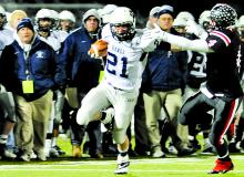 Berwick's Dain Kowalski pushes off a tackle by Clearfield's Christian Lezzer Friday at Central Mountain. Berwick defeated Clearfield, 44-7.
