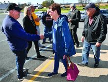 Montour County Commissioner candidate Scott Lynn, left, shakes Donna Wydra’s hand outside of the First Baptist Church in Valley Township Tuesday. 