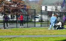 A group of women take to the pickle ball courts Thursday morning at a Scott Township park recently. Some Scott Township residents want the supervisors to move forward with restrictions on the pickleball courts in Scott School Park.