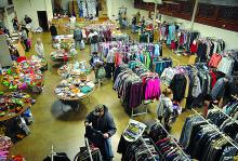 Family members choose clothing, toys and food during the annual Danville Community Christmas Tree giveaway in the Danville Borough Hall ballroom on Friday morning.