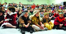 Kindergaren students sit dressed as shepherds and kings during the St. Columbia School Christmas program Thursday at the Bloomsburg school.