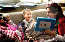 Janet Weis Children’s Hospital patient Lia Hart, 6, of Montoursville, talks from her room to Santa Claus via webcam on an iPad at Geisinger Medical Center in Danville on Wednesday morning. Visiting children with the iPad is Santa’s head elf, Mary Tiffin. 