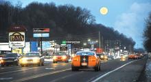 The full Cold Moon rises up over Route 11 in Scott Township Monday evening. This is the last full moon of 2013.