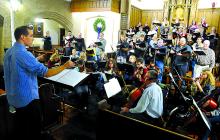 Alan J. Hack, left, directs The Jubilate Choir and Orchestra during rehearsal for The Manger of Bethlehem Friday evening at St. Matthew Lutheran Church in Bloomsburg. The ensemble will perform at the church today at 7 p.m. and Sunday at 3 p.m. Admission is free.