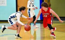 Millville’s Ayden Boyunegmez, left, cuts in and around Canton’s Quincy Wesneski during the first quarter of Monday night’s game at Millville. 