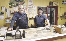 Rodney, left, and Mark Bardo stand behind the counter of Bardo’s Tire Sales in Bloomsburg. The brothers are closing the business just shy of its 50th anniversary.