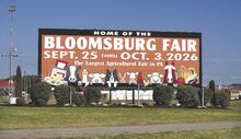 The longtime billboard on the Bloomsburg Fairgrounds now displays the dates for the 2026 Bloomsburg Fair, as seen on Sunday.