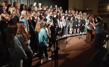 Jennifer DiLossi, at far right, directs the chorus during a rehearsal Monday morning in the Benton High School Auditorium. The school will present the “Melodies of Spring” concert Wednesday at 7 p.m. in the auditorium. 
