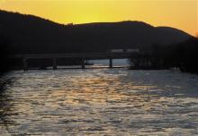 Tractor-trailers cross over the Susquehanna River on the Interstate 80 bridges at Mifflinville on Tuesday.