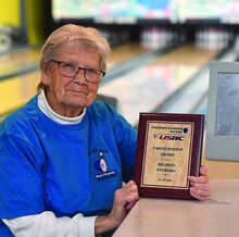 Millie Miller sits at one of the scoring tables at the P-Nut Bowl in Scott Township. Miller has recently ended her bowling career after 60 years.