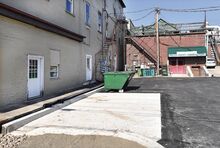 Bloomsburg recently installed a concrete pad for water reduction in the Pine Avenue parking lot. A landlord is arguing he shouldn’t have to pay a suggested fee for a parking spot because the reconstruction took away his access
