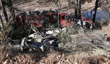 A dump truck careened down an embankment off Route 118 near the East Branch of Fishing Creek on Friday. It nearly struck a pickup truck head-on.