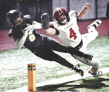 Southern Columbia’s Joey Williams is knocked out of bounds just short of the goal line by Bloomsburg defender Shane Frey during the District 4 Class 2A semifinal at Tiger Stadium on Friday night. Southern won, 41-21.