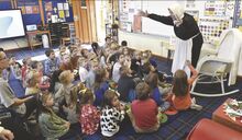 Kathi Beiter, at right above, portrays Elizabeth Hopkins, a passenger who came to America on the Mayflower, while talking to the students at St. Cyril Academy Tuesday morning at the school in Mahoning Township.